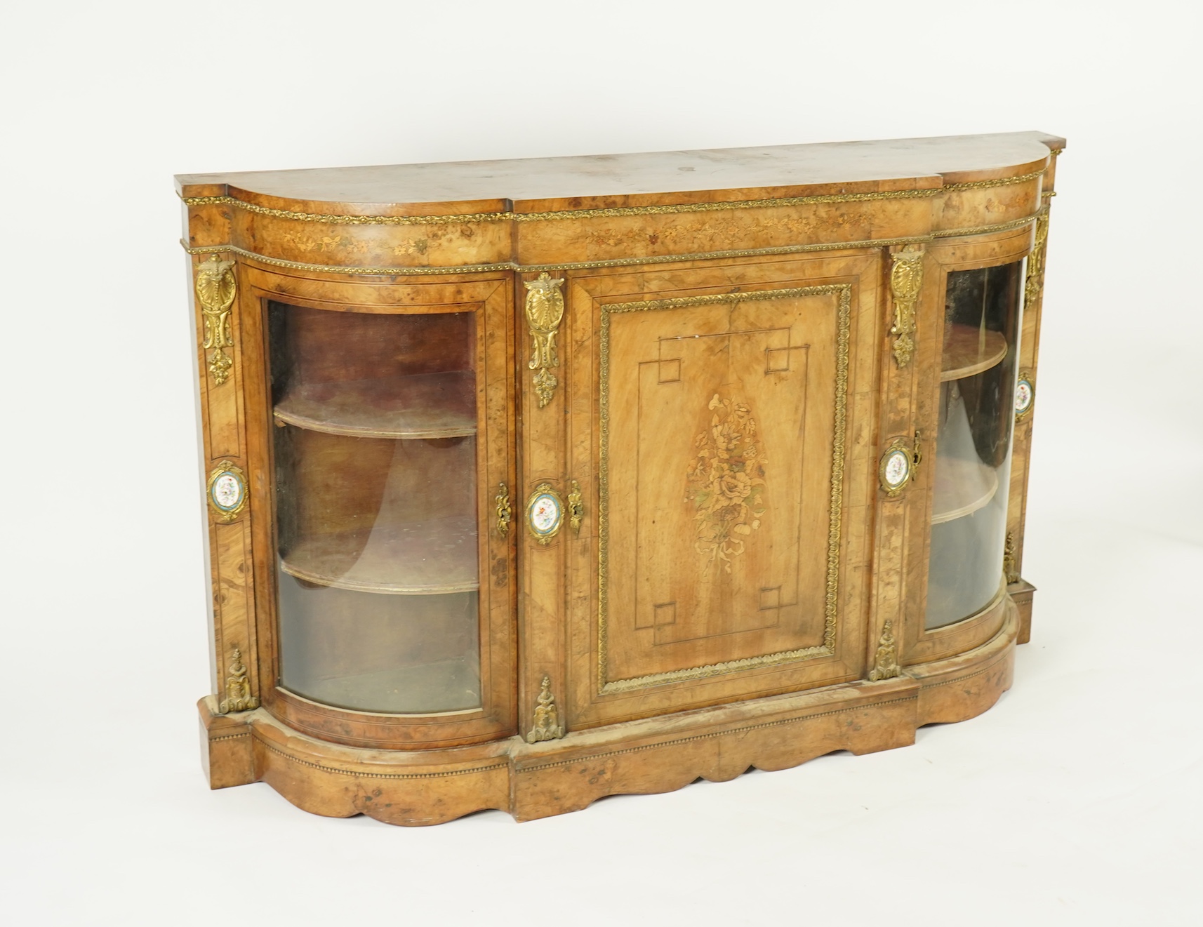 A Victorian marquetry inlaid, gilt metal mounted bowfront side cabinet